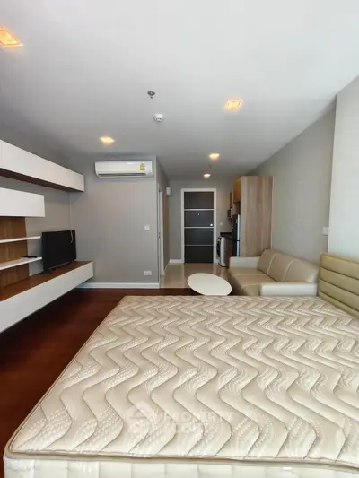 Modern studio apartment with stylish furniture and cozy ambiance