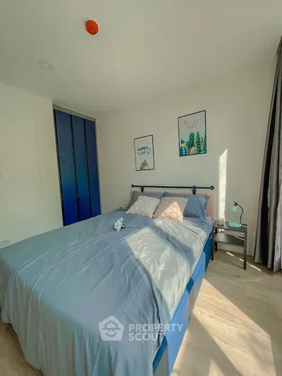 Bright and cozy bedroom with modern decor and ample natural light