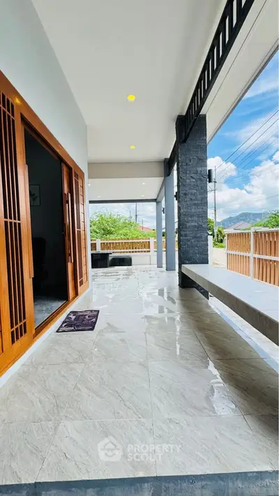 Spacious modern patio with sleek design and scenic view