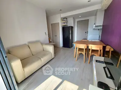 Bright modern living room with cozy sofa and dining area