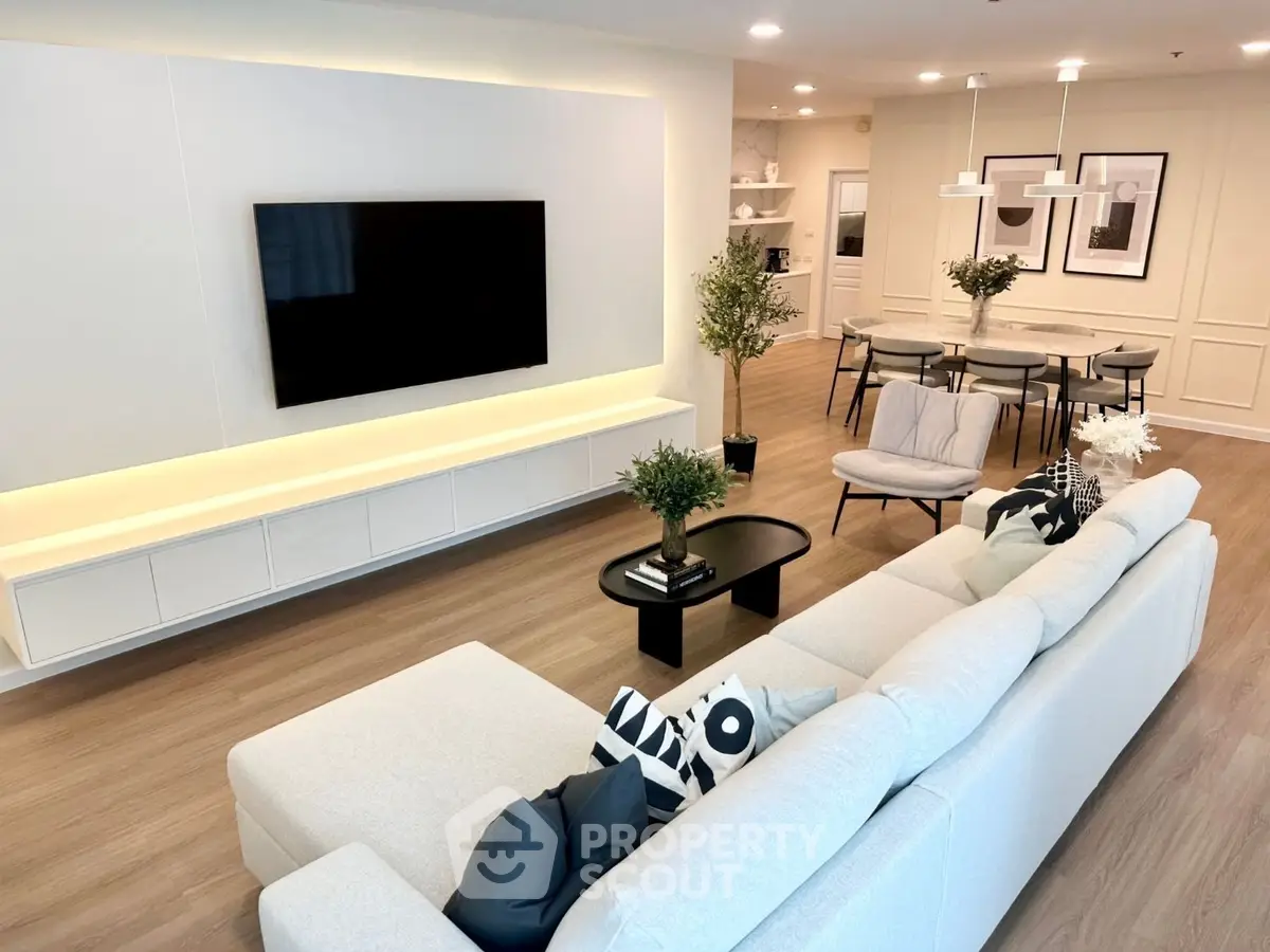 Spacious modern living room with sleek design and open dining area