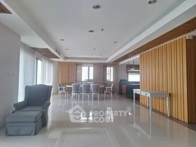 Spacious open-plan living and dining area with modern design and natural light.