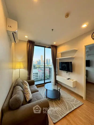 Modern living room with city view, cozy sofa, and wall-mounted TV in high-rise apartment.