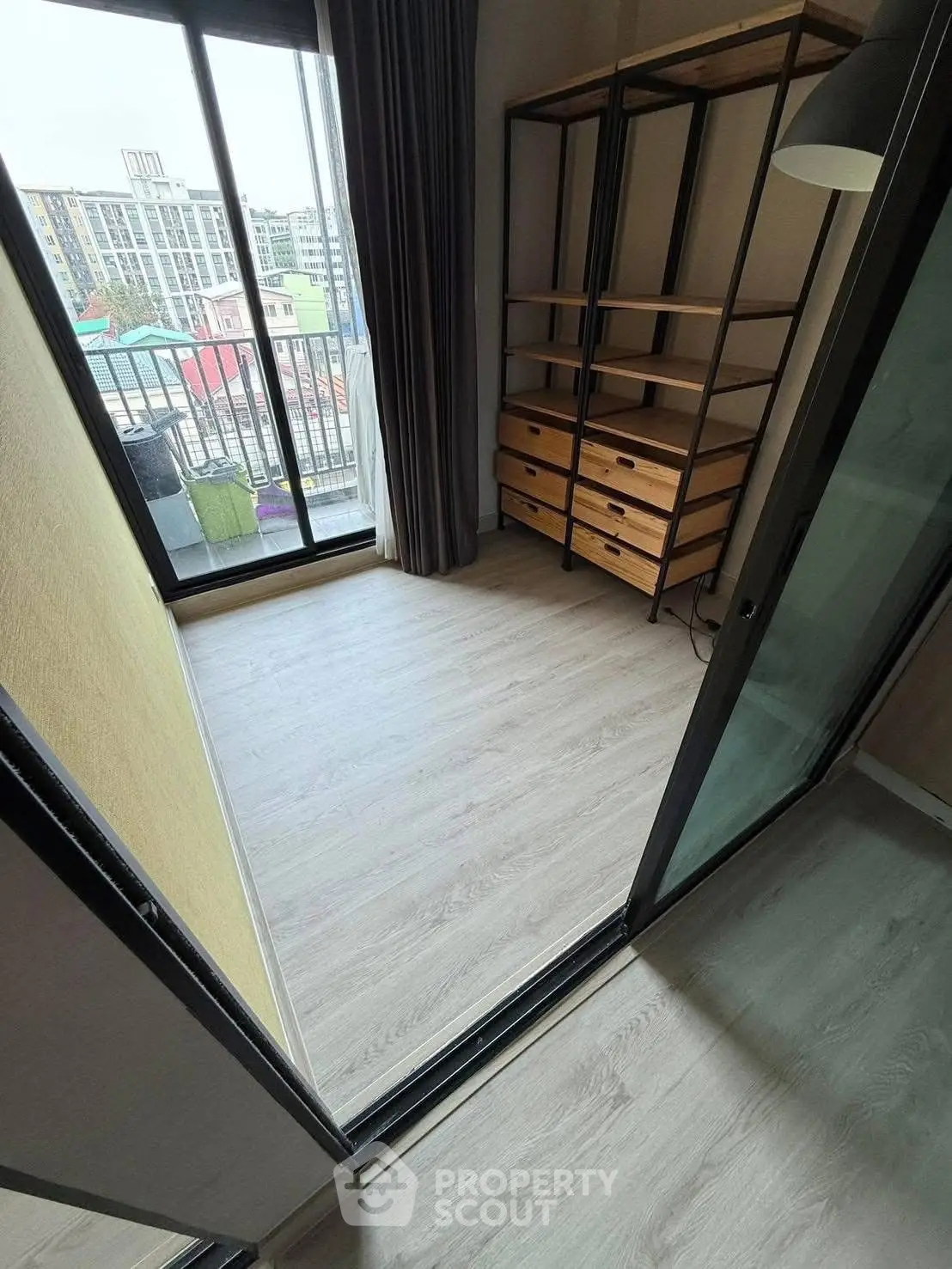 Spacious balcony with city view and modern storage unit