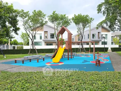 Modern residential community with playground and contemporary homes.