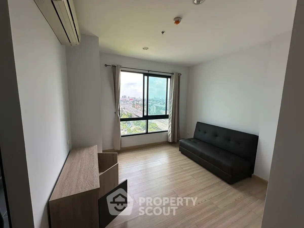 Modern minimalist living room with city view and sleek furniture