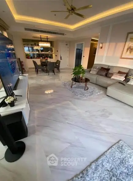 Luxurious living room with elegant marble flooring and modern decor