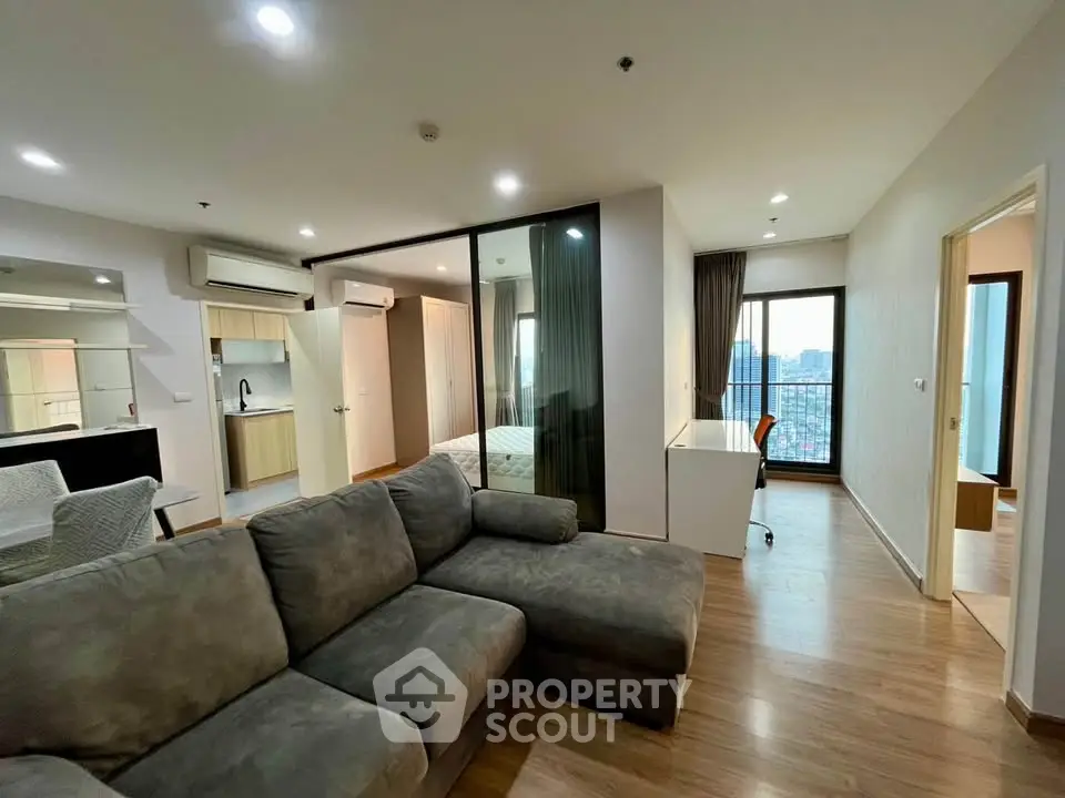 Modern apartment interior with open living room and city view