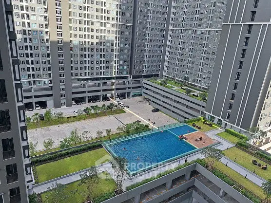 Modern apartment complex with pool and landscaped gardens