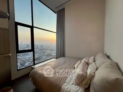 Luxurious bedroom with stunning city view and modern decor