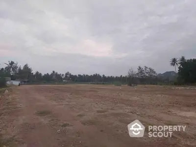 Expansive plot of land with scenic views, ideal for development or agriculture, surrounded by lush greenery.