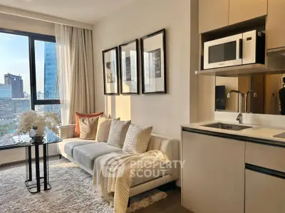 Modern living room with city view, cozy sofa, and sleek kitchenette in urban apartment.