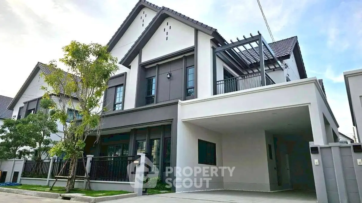 Modern two-story house with sleek design and spacious driveway