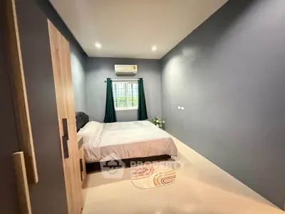 Modern bedroom with minimalist decor and air conditioning