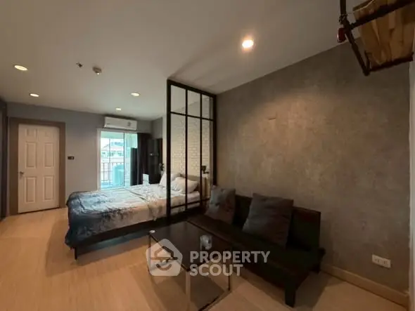 Modern studio apartment with cozy living area and stylish decor