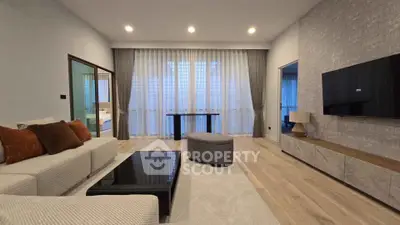 Spacious modern living room with elegant decor and natural light