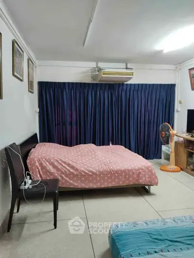 Cozy bedroom with air conditioning and stylish decor