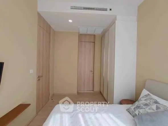 Cozy bedroom with modern design and ample natural light