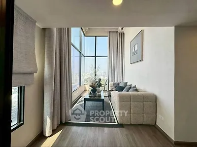 Luxurious living room with floor-to-ceiling windows and stunning city view