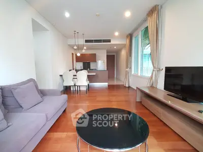 Spacious modern living room with open kitchen and elegant furnishings