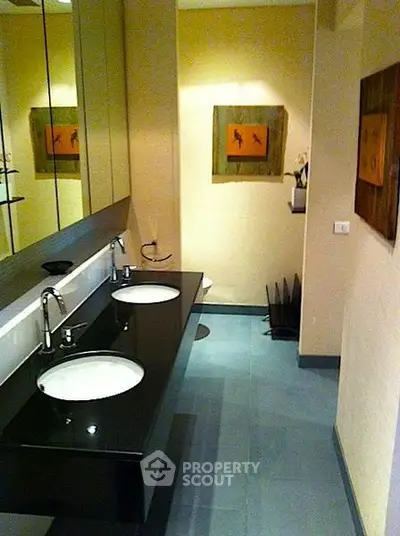 Modern bathroom with dual sinks and stylish decor