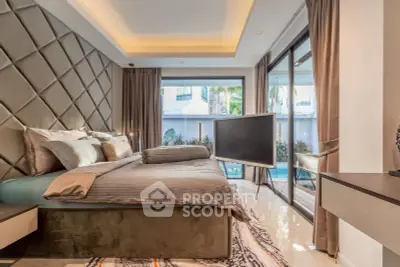 Luxurious bedroom with pool view and modern decor