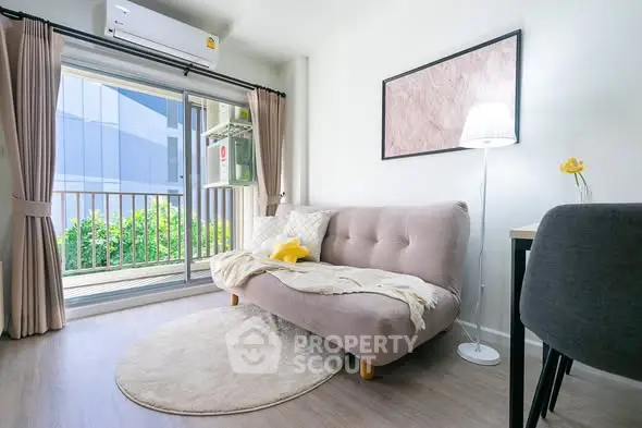 Modern living room with cozy sofa and balcony view