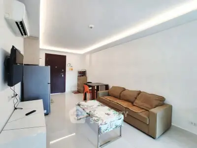 Modern living room with sleek design and cozy seating area.