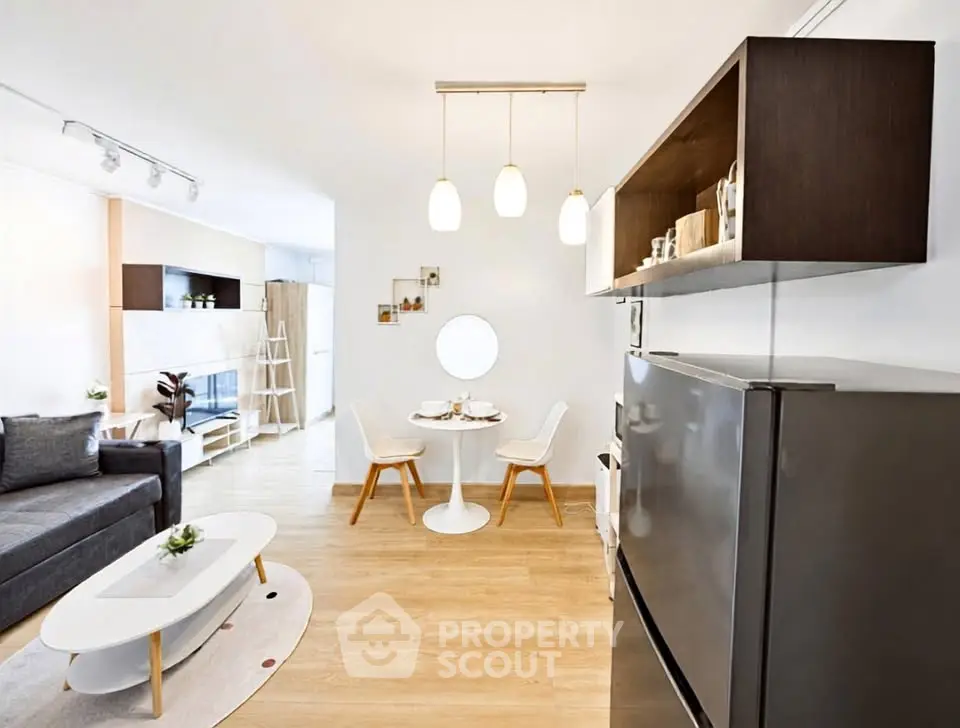 Modern open-plan living room with stylish furniture and dining area