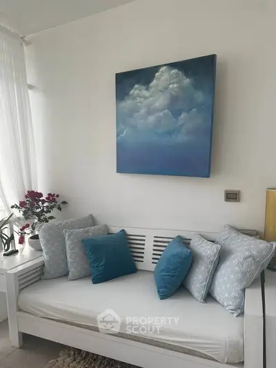 Charming living room with cozy seating and elegant decor, perfect for relaxation and comfort.