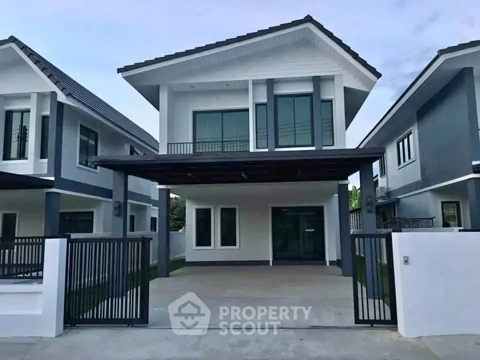 Modern two-story house with sleek design and spacious driveway