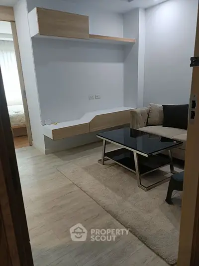 Modern living room with sleek furniture and wooden flooring