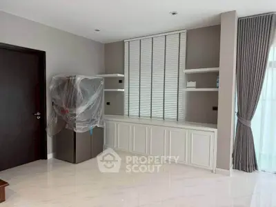 Spacious modern living room with sleek design and large windows