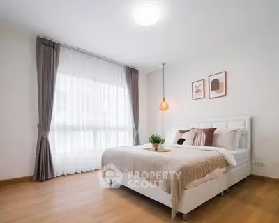 Modern bedroom with elegant decor and natural light