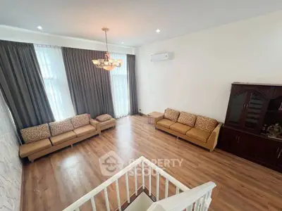 Spacious living room with elegant decor and natural light