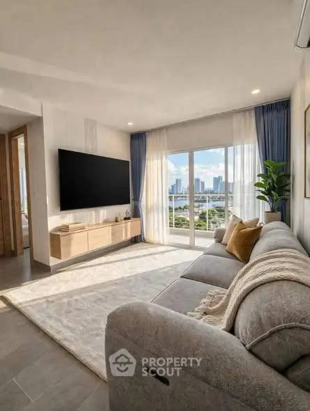 Spacious living room with large windows offering stunning city views, modern decor, and cozy seating.