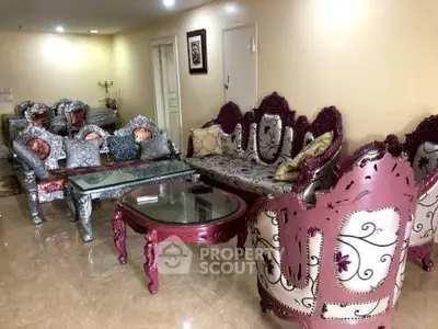 Luxurious living room with ornate furniture and elegant decor