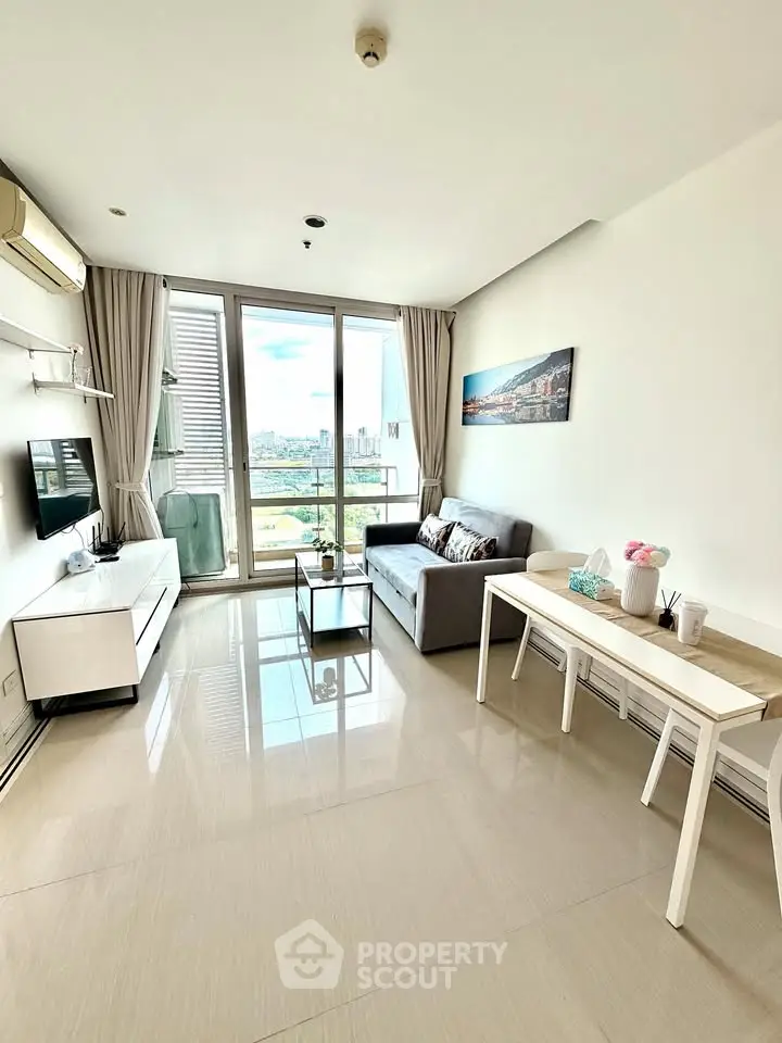 Bright modern living room with city view, sleek furniture, and large windows.