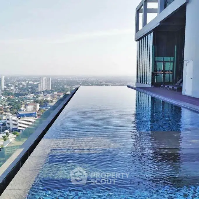Luxurious rooftop infinity pool with stunning city skyline view