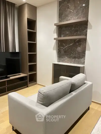 Modern living room with sleek design and elegant shelving