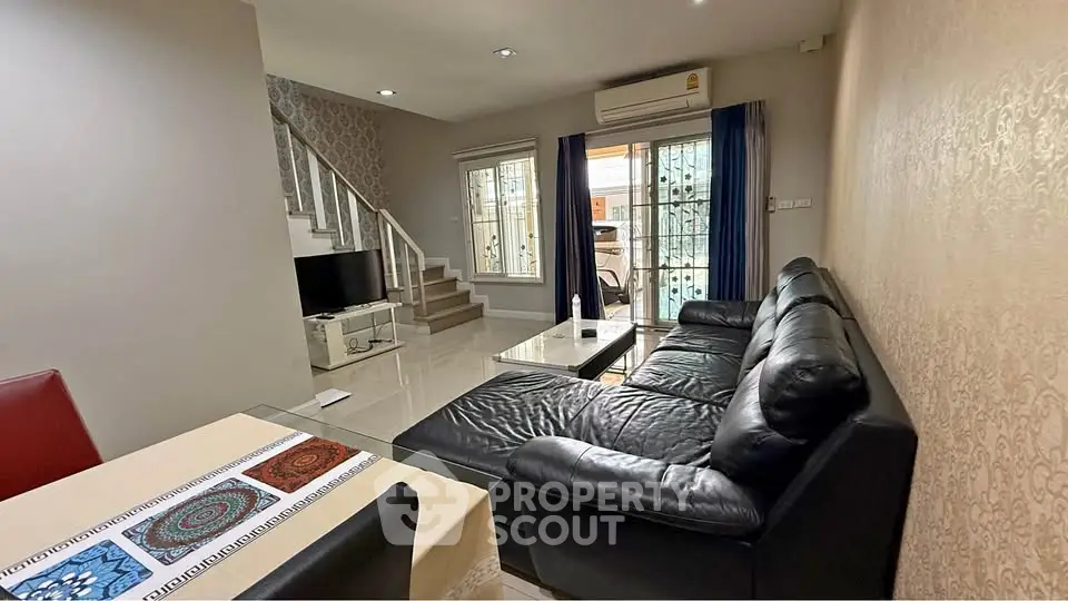 Spacious living room with modern decor and leather sofa in a stylish home