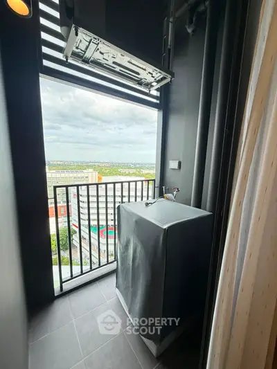 Modern balcony with city view and air conditioning unit, perfect for urban living.