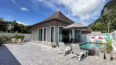 Luxurious villa with private pool and spacious patio in tropical setting