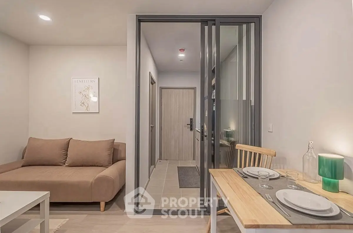 Modern living room with cozy sofa and dining area in stylish apartment