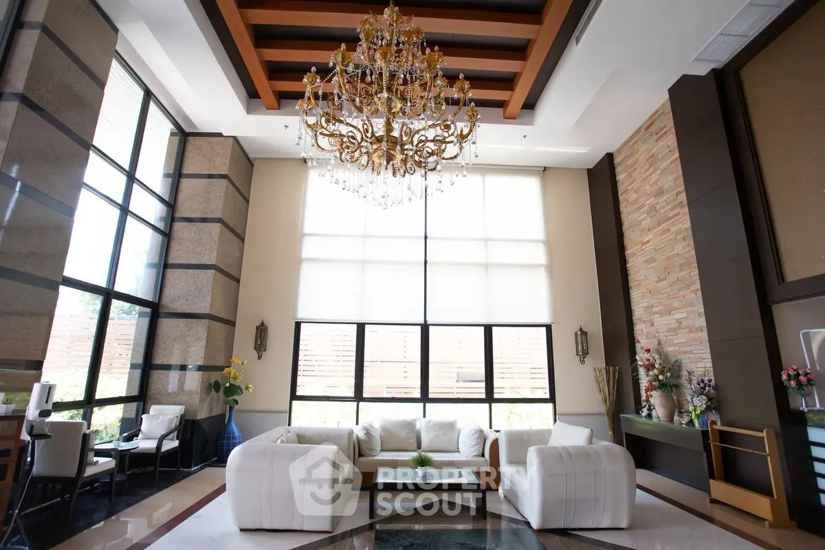 Luxurious living room with high ceilings and elegant chandelier