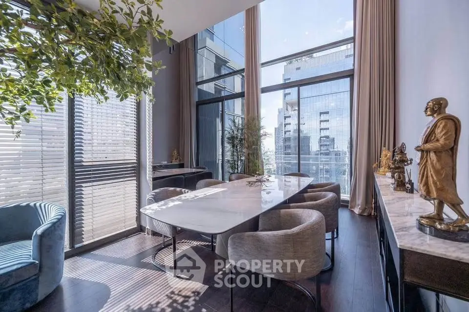 Luxurious modern dining room with floor-to-ceiling windows and elegant decor