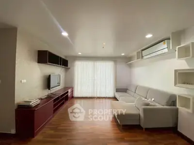 Spacious living room with modern furniture and natural light