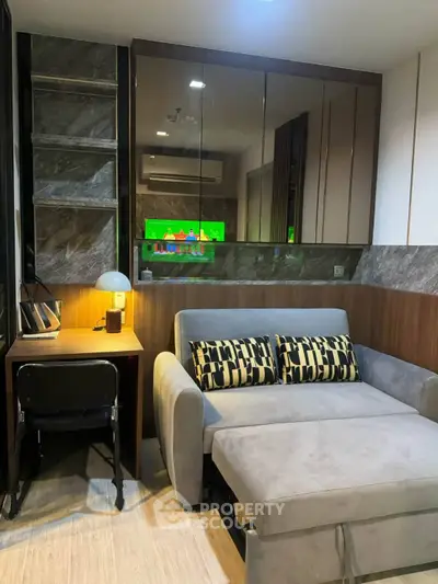 Modern living room with stylish sofa and workspace in a cozy apartment
