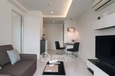 Modern living room with sleek furniture and stylish decor in a contemporary apartment.