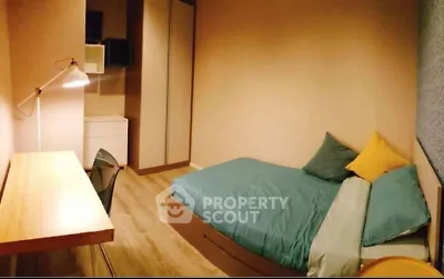 Cozy bedroom with modern decor and wooden flooring